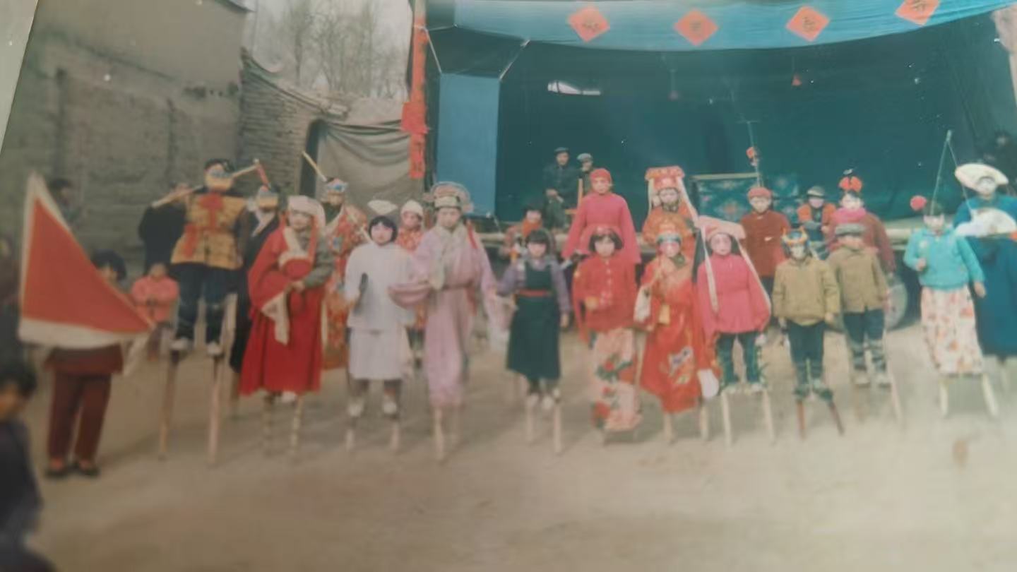 Stilt-walking during a village Spring Festival, circa 1990